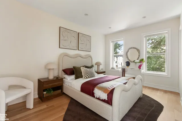 a bathroom with a double vanity sink toilet and shower