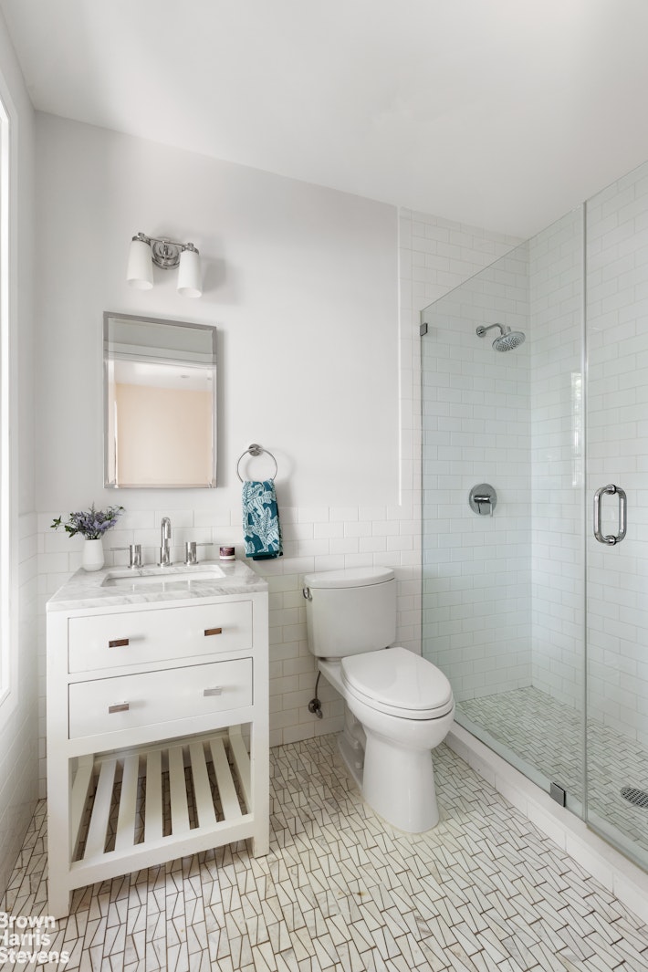 605 Decatur Street Brooklyn, NY 11233 - Photo 11 of 14 a bathroom with a sink toilet vanity and shower