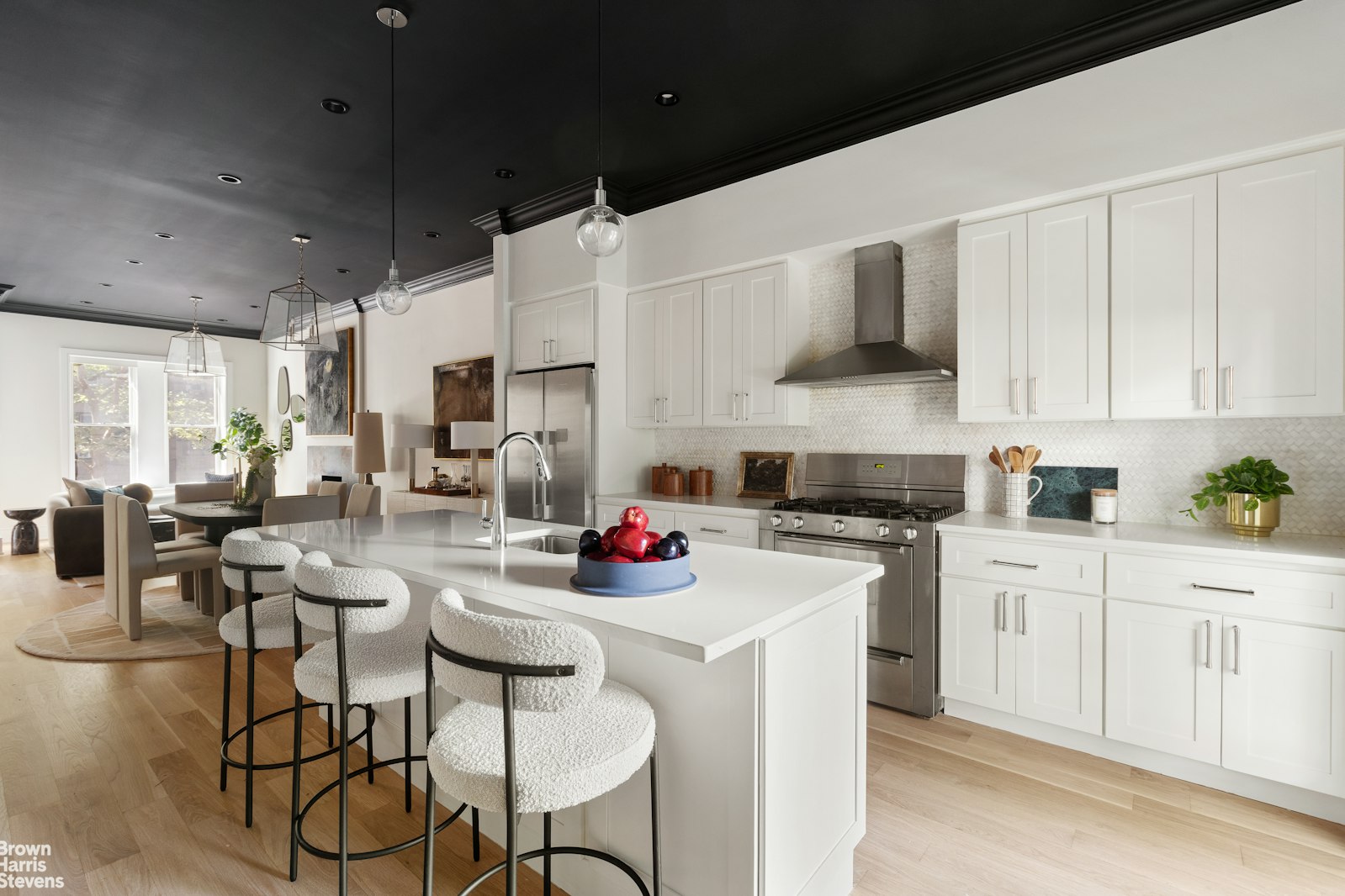 605 Decatur Street Brooklyn, NY 11233 - Photo 6 of 14 a kitchen with a sink stove and white cabinets
