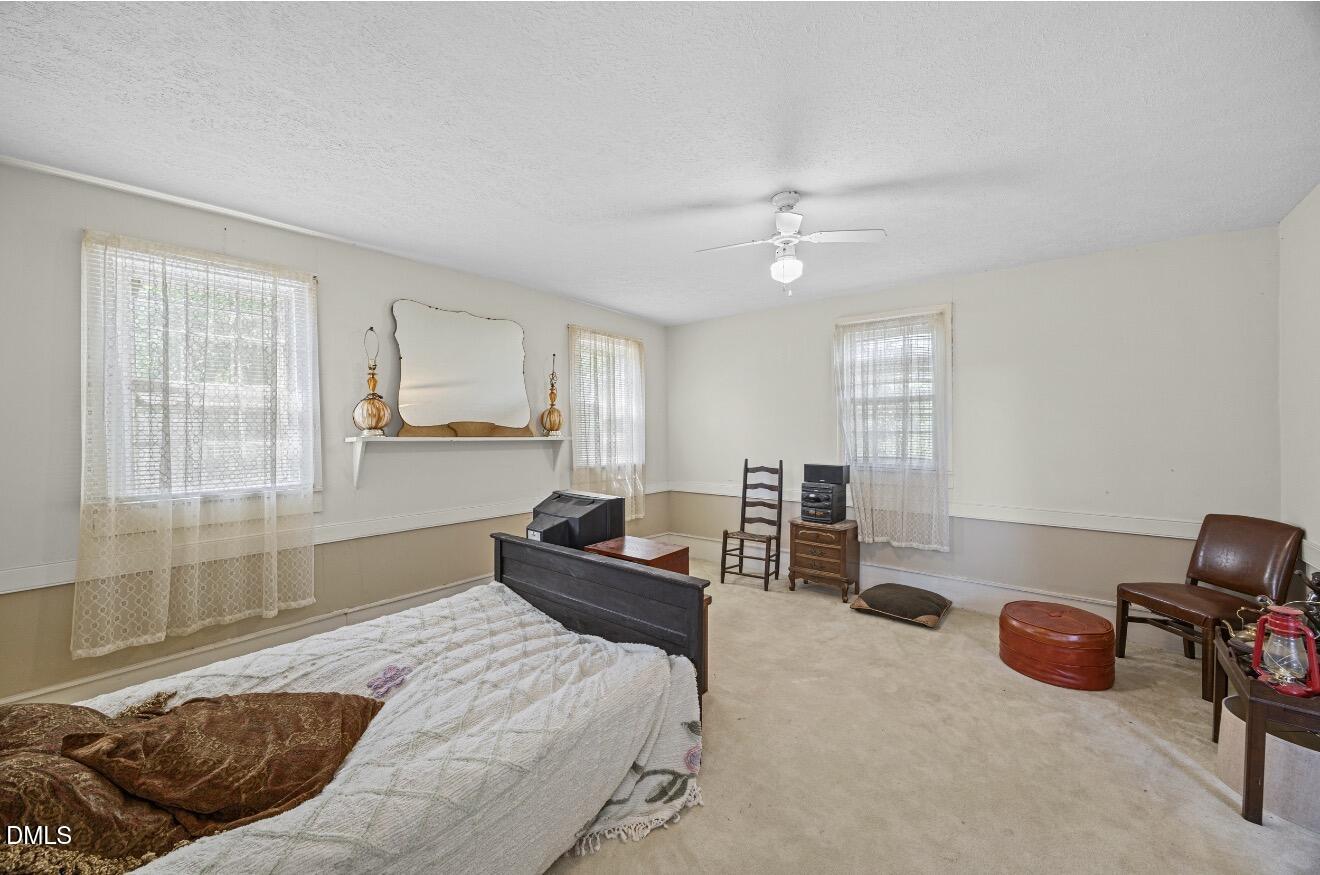 679 Mintz Road Roseboro, NC 28382 - Photo 29 of 80 a bedroom with furniture and a window