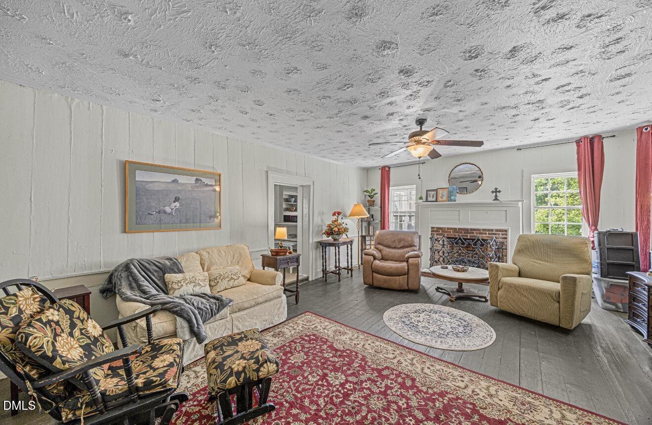 679 Mintz Road Roseboro, NC 28382 - Photo 7 of 80 a living room with furniture and a fireplace