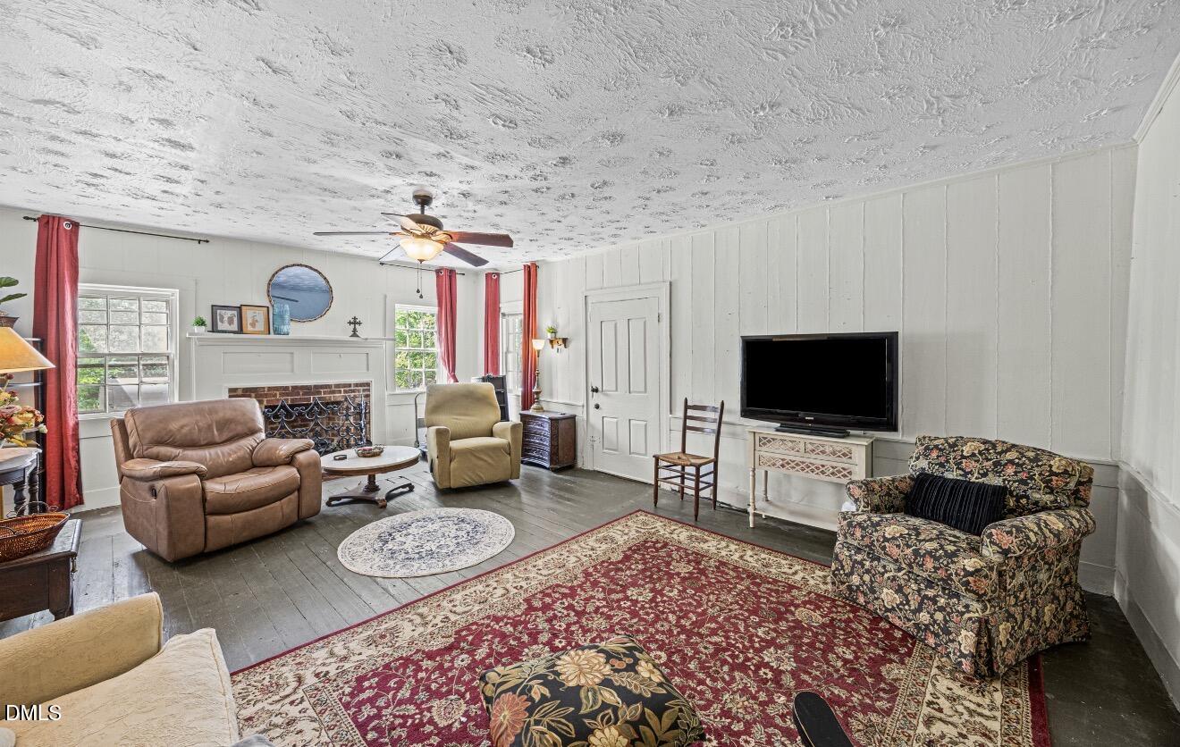 679 Mintz Road Roseboro, NC 28382 - Photo 8 of 80 a living room with furniture and a flat screen tv