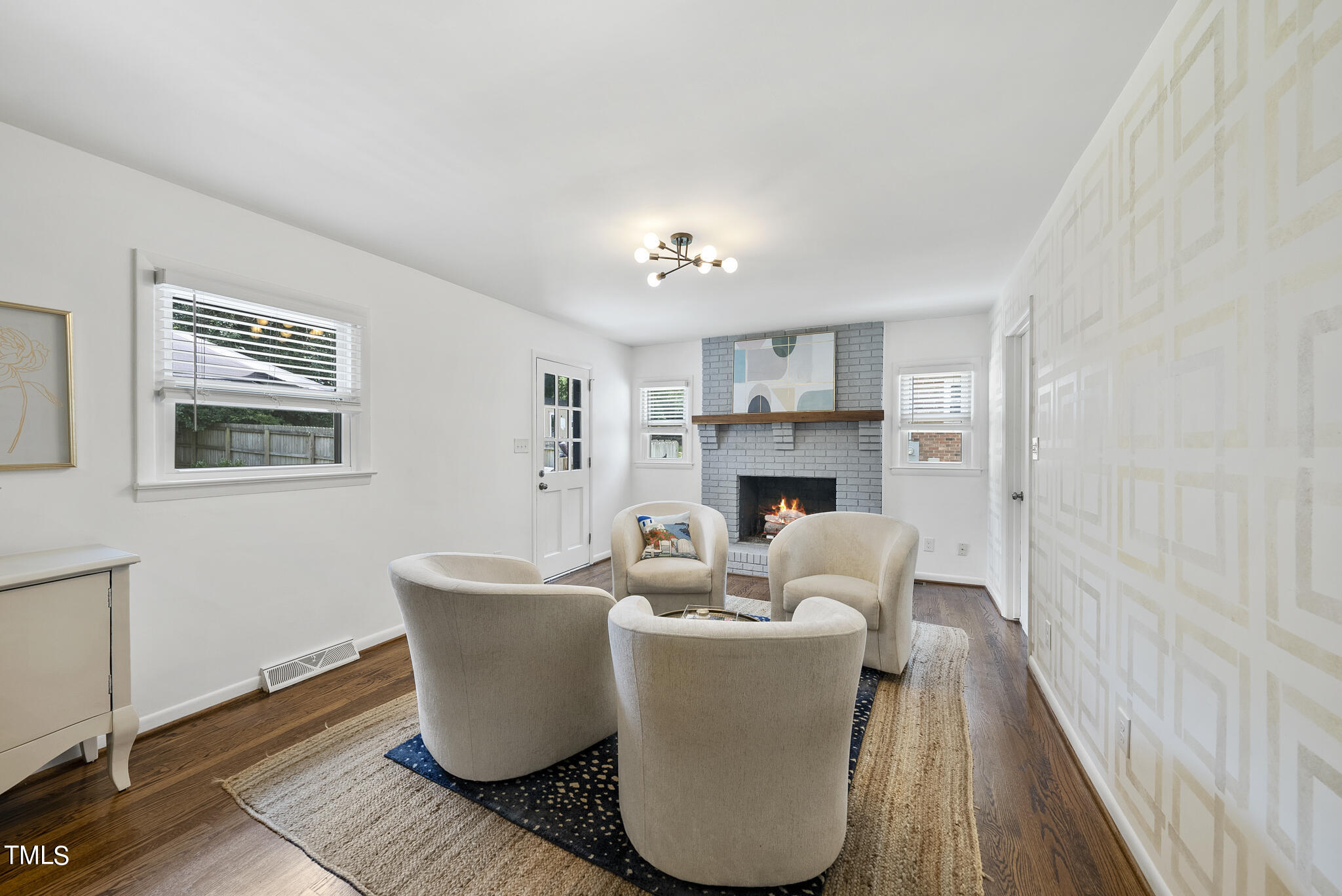 512 East Millbrook Road Raleigh, NC 27609 - Photo 11 of 29 a living room with furniture and a fireplace