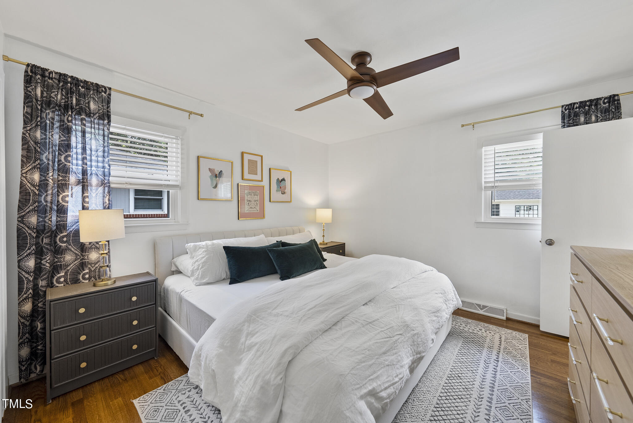 512 East Millbrook Road Raleigh, NC 27609 - Photo 14 of 29 a bedroom with a bed and a window