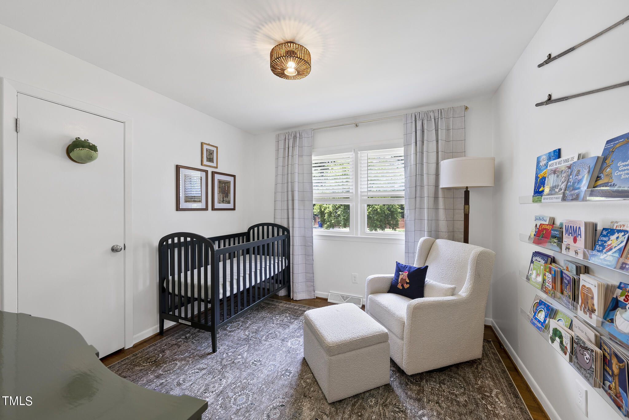 512 East Millbrook Road Raleigh, NC 27609 - Photo 17 of 29 a living room with furniture and a window