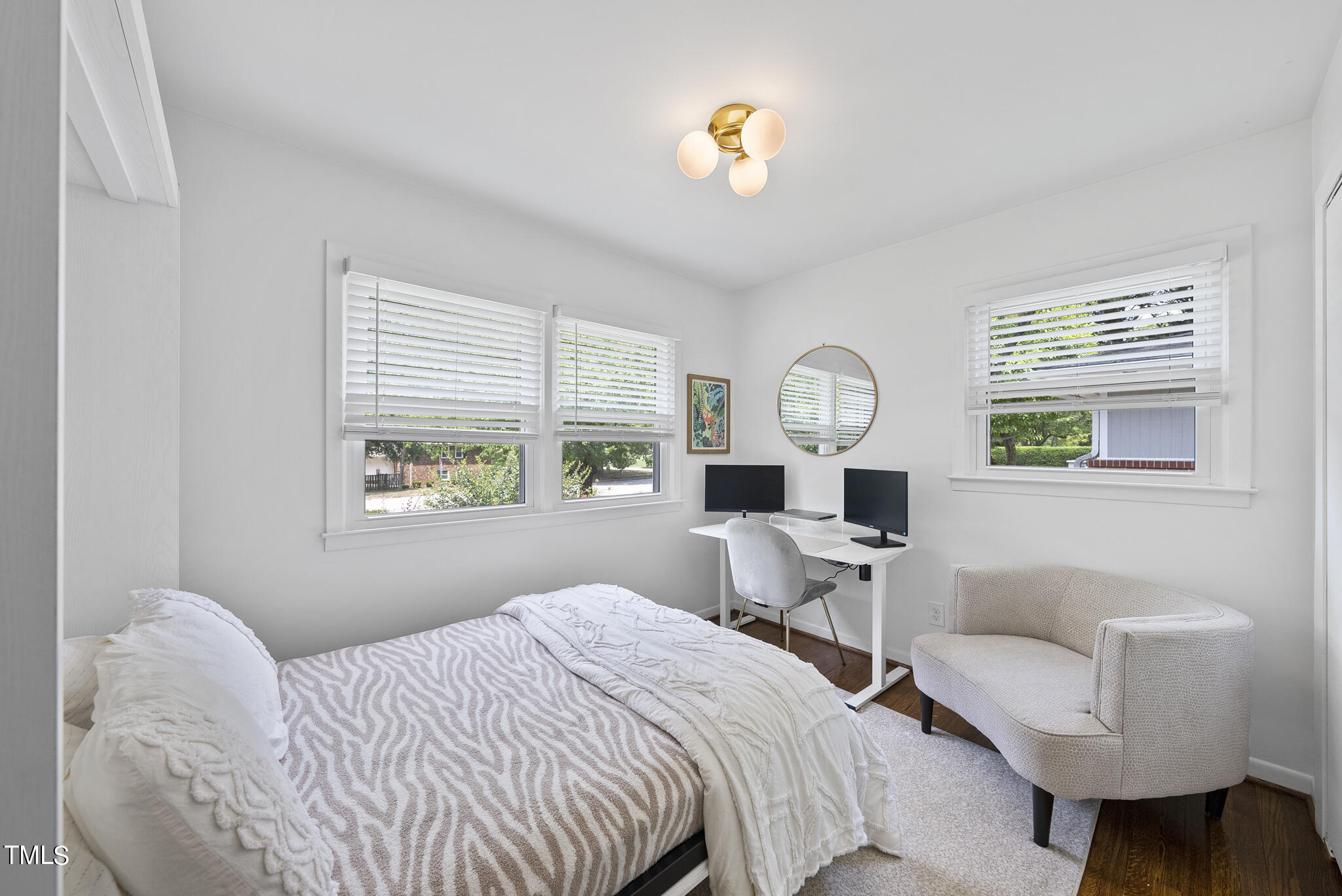 512 East Millbrook Road Raleigh, NC 27609 - Photo 19 of 29 a bedroom with a bed and a window