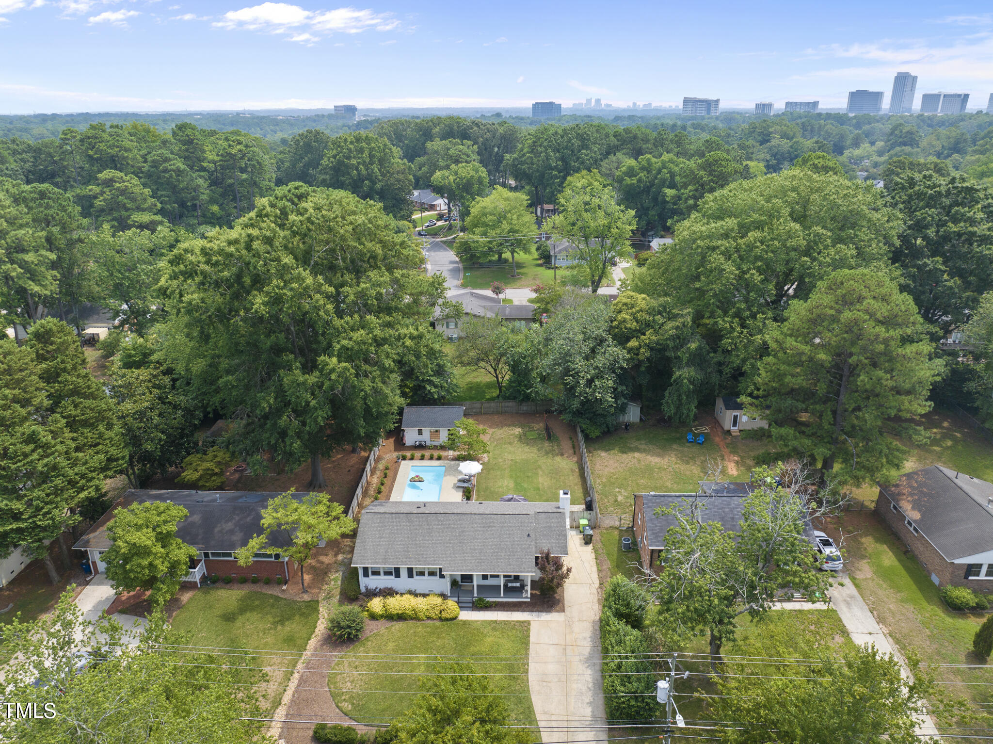 512 East Millbrook Road Raleigh, NC 27609 - Photo 2 of 29 an aerial view of a house with a yard basket ball court and outdoor seating