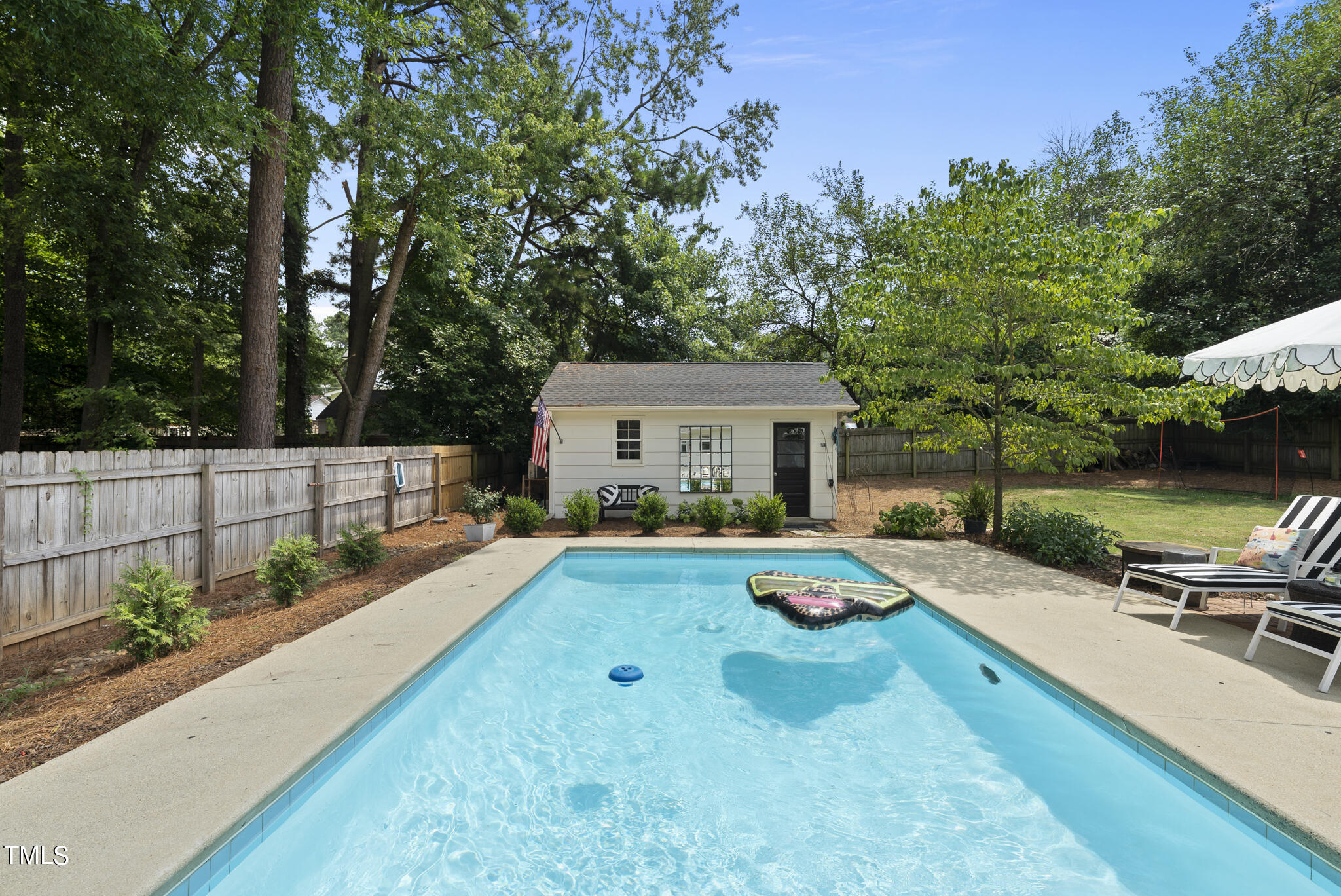 512 East Millbrook Road Raleigh, NC 27609 - Photo 23 of 29 a front view of a house with garden