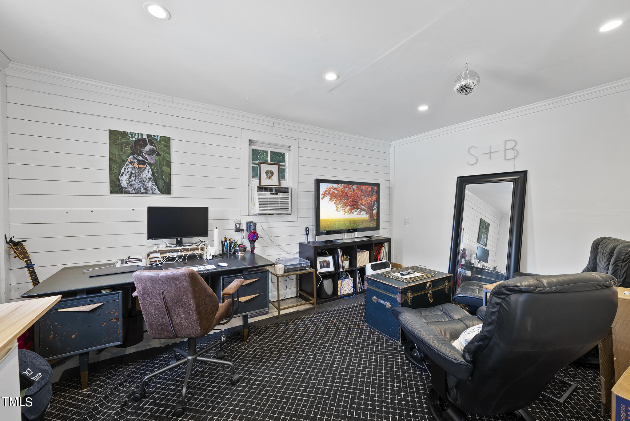 512 East Millbrook Road Raleigh, NC 27609 - Photo 24 of 29 a living room with furniture and a flat screen tv