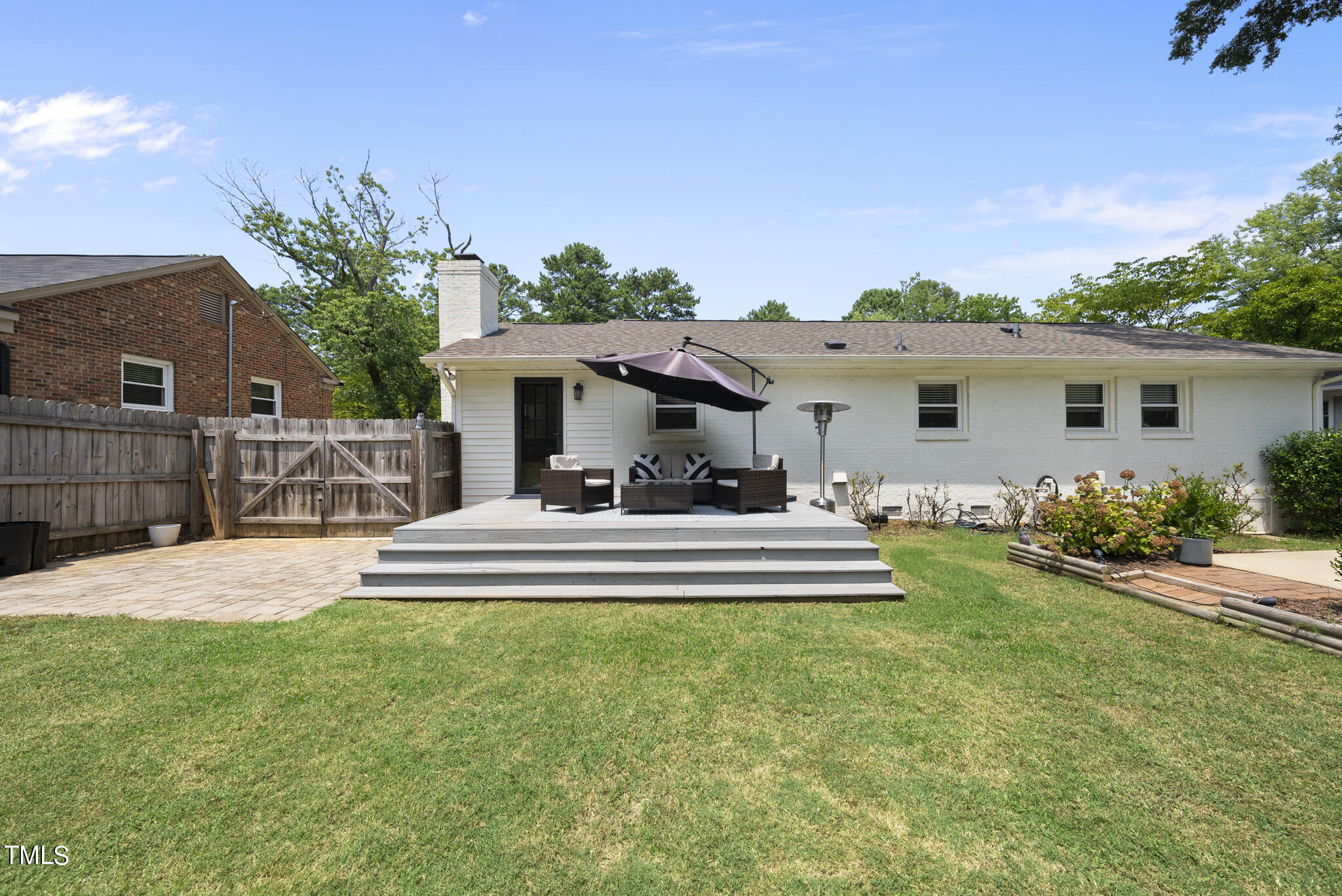 512 East Millbrook Road Raleigh, NC 27609 - Photo 25 of 29 a view of house with outdoor space and porch