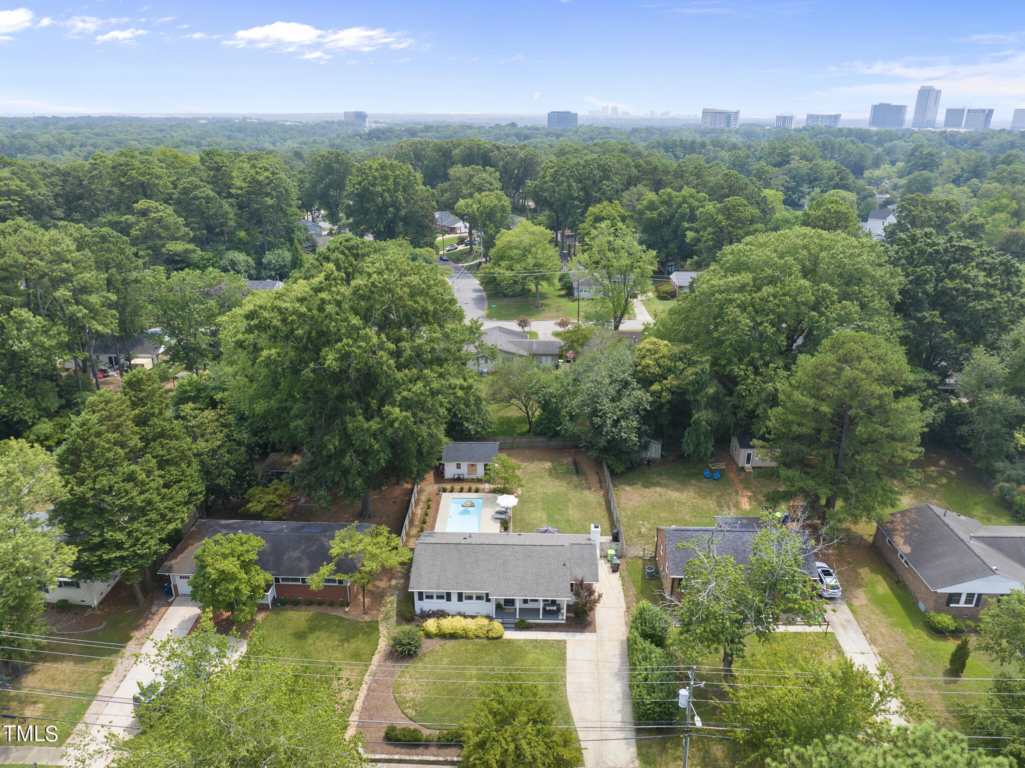 512 East Millbrook Road Raleigh, NC 27609 - Photo 28 of 29 an aerial view of a house with a yard basket ball court and outdoor seating