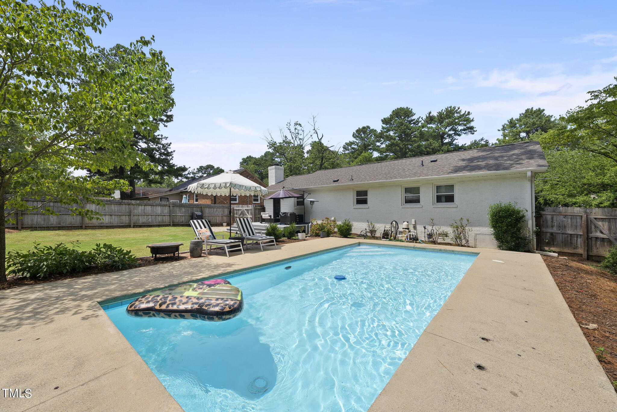512 East Millbrook Road Raleigh, NC 27609 - Photo 3 of 29 a front view of house with yard and outdoor seating