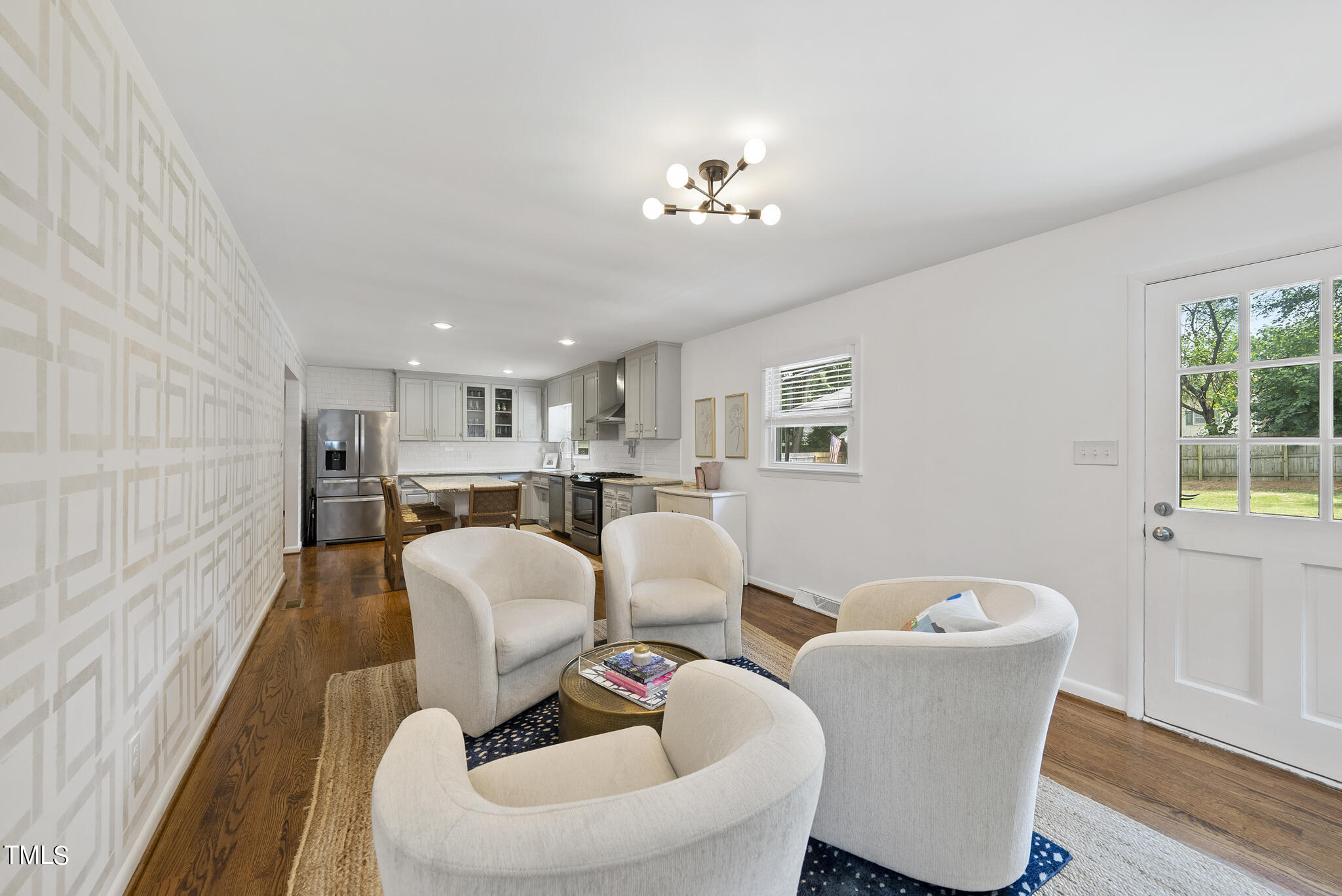 512 East Millbrook Road Raleigh, NC 27609 - Photo 10 of 29 a living room with furniture and a table