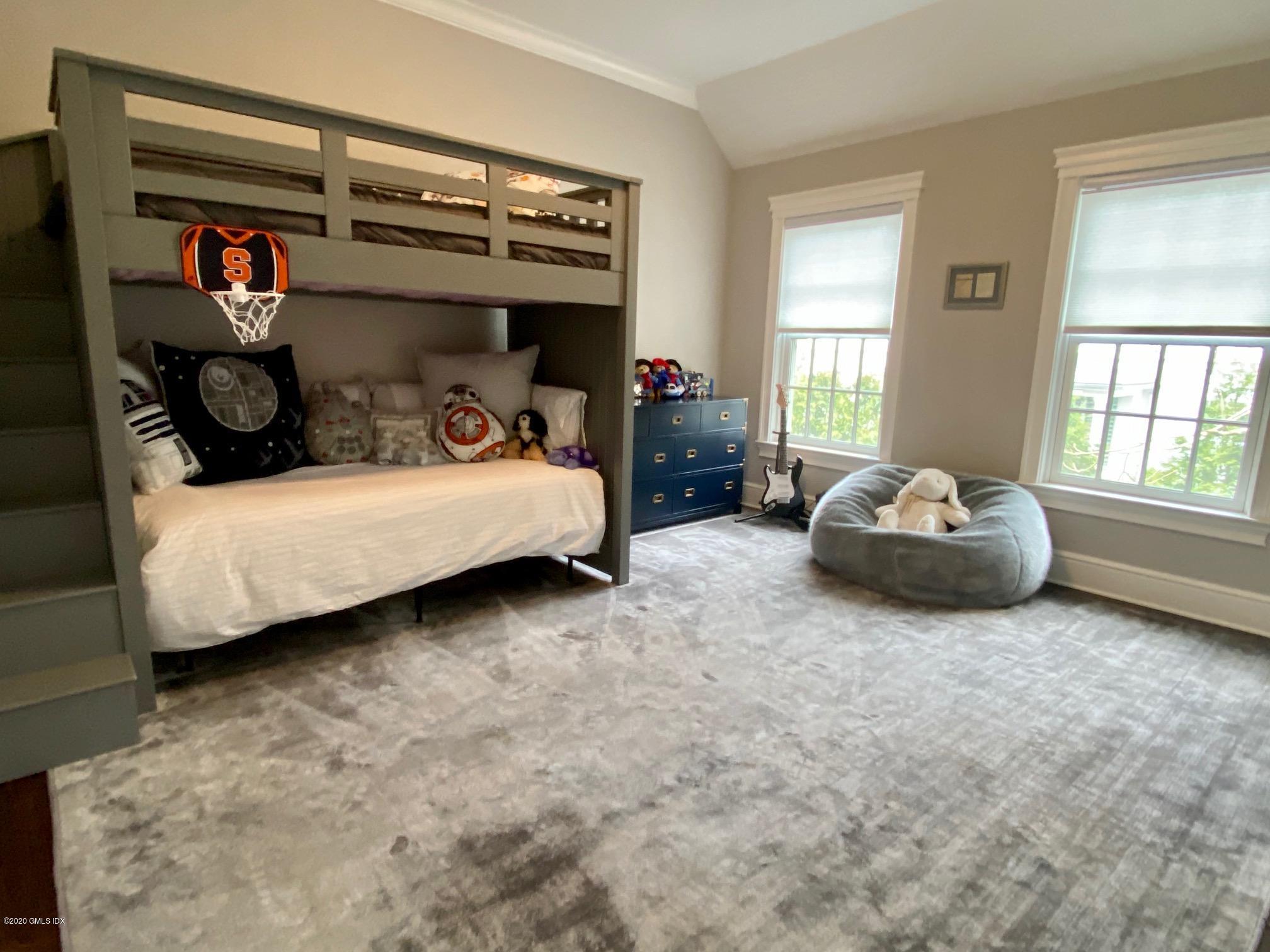 1 Club Road Riverside, CT 06878 - Photo 26 of 37 a bedroom with furniture and a window