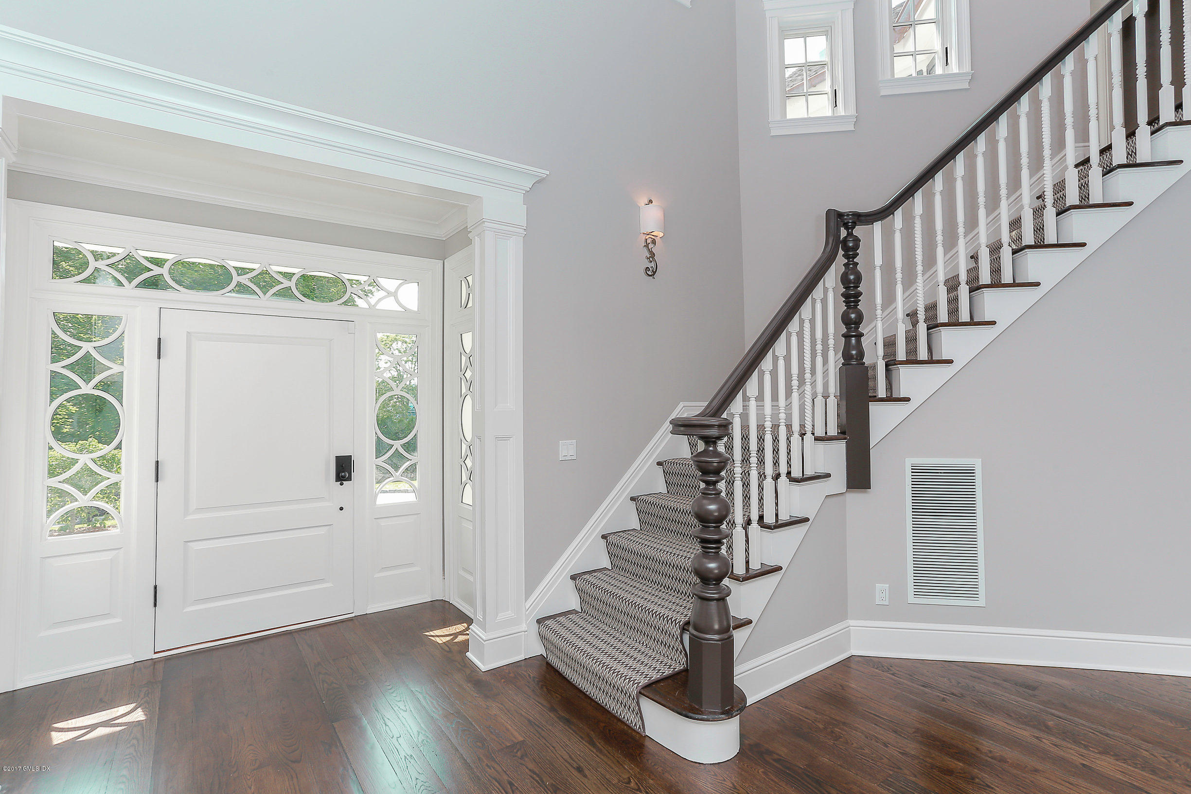 1 Club Road Riverside, CT 06878 - Photo 5 of 37 a view of entryway with wooden floor and stairs