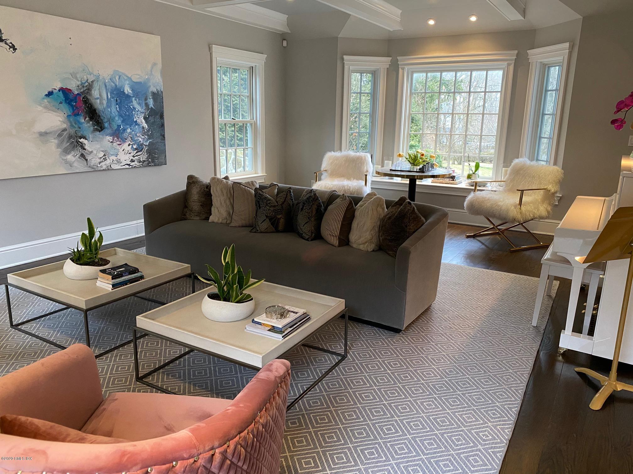 1 Club Road Riverside, CT 06878 - Photo 8 of 37 a living room with furniture a rug and a large window