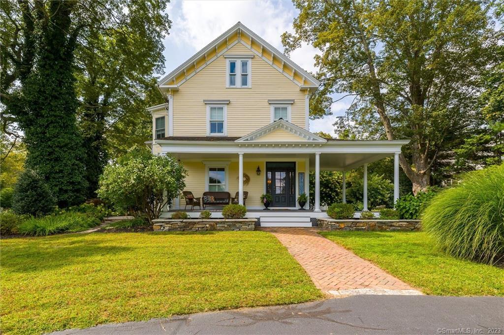 326 Thompson Road Thompson, CT 06277 - Photo 1 of 1 a front view of a house with swimming pool and chairs