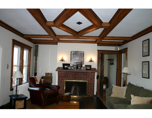 19 Sunset Road, Unit 19 Watertown, MA 02472 - Photo 2 of 17 a living room with furniture and a fireplace