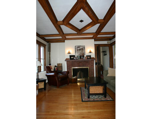19 Sunset Road, Unit 19 Watertown, MA 02472 - Photo 4 of 17 a living room with furniture and a fireplace