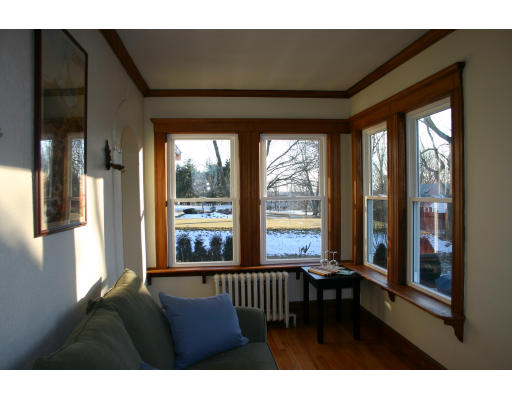 19 Sunset Road, Unit 19 Watertown, MA 02472 - Photo 5 of 17 a living room with furniture and a floor to ceiling window