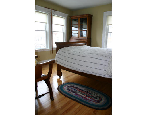 19 Sunset Road, Unit 19 Watertown, MA 02472 - Photo 6 of 17 a bedroom with a bed and a window