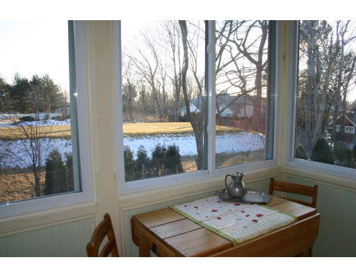 19 Sunset Road, Unit 19 Watertown, MA 02472 - Photo 10 of 17 a view of a wooden floor and a terrace view