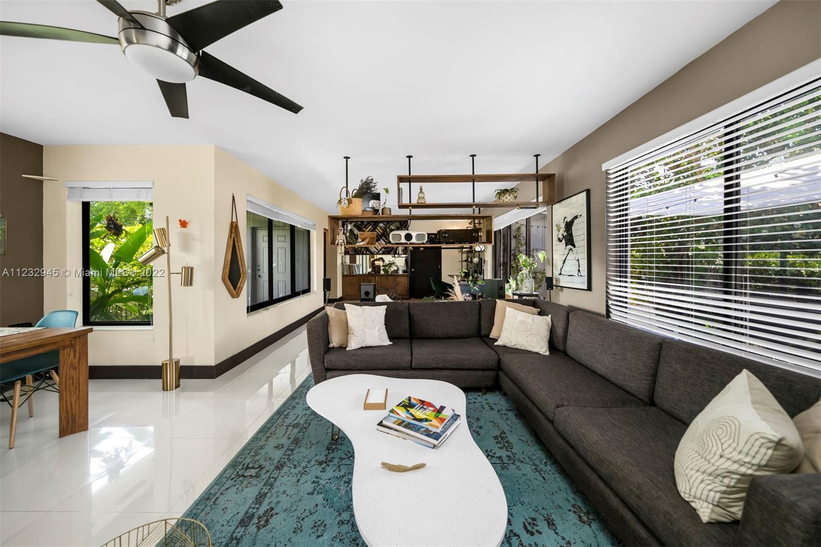 1598 Normandy Drive Miami Beach, FL 33141 - Photo 17 of 40 a living room with furniture and a window