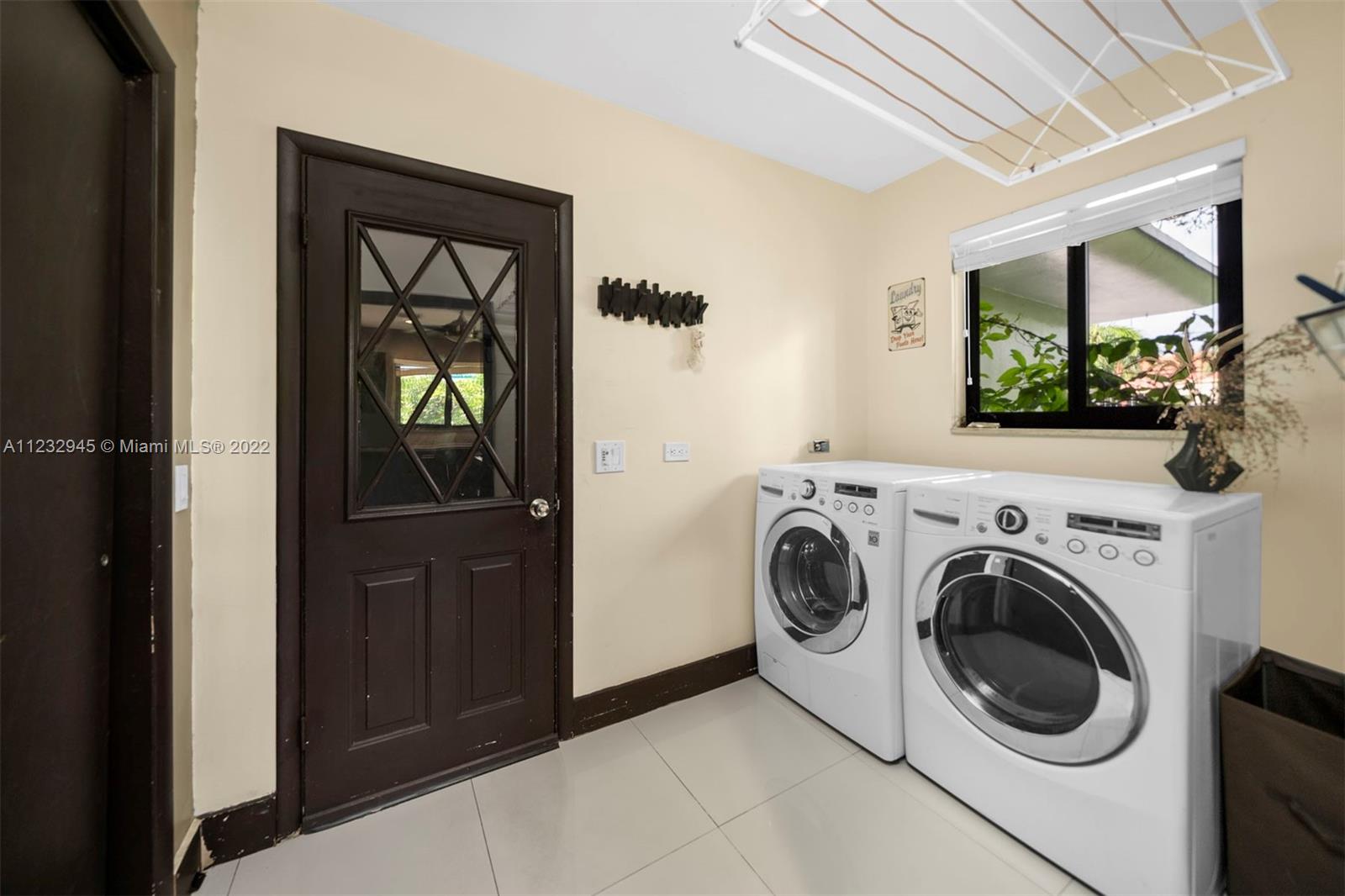 1598 Normandy Drive Miami Beach, FL 33141 - Photo 21 of 40 a utility room with dryer and washer