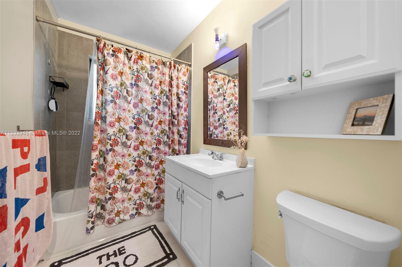 1598 Normandy Drive Miami Beach, FL 33141 - Photo 23 of 40 a bathroom with a sink toilet and shower