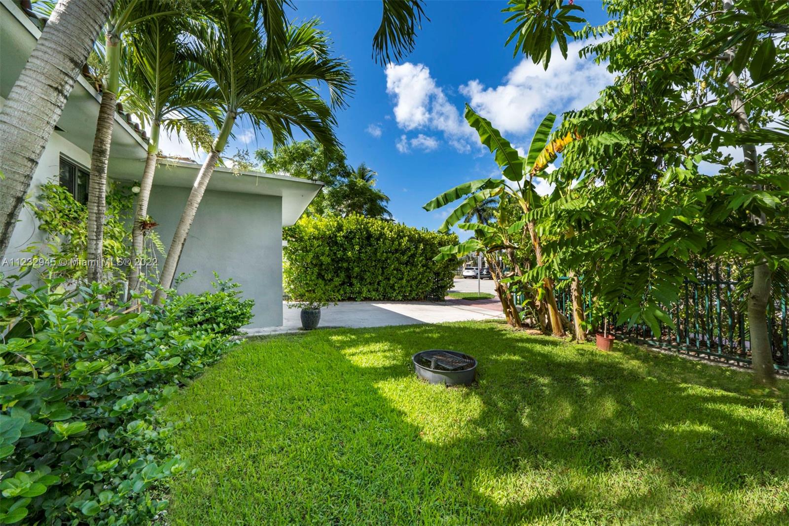 1598 Normandy Drive Miami Beach, FL 33141 - Photo 7 of 40 a view of a yard with a tree