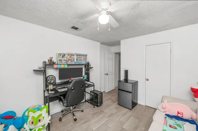 a view of a workspace with furniture and toys