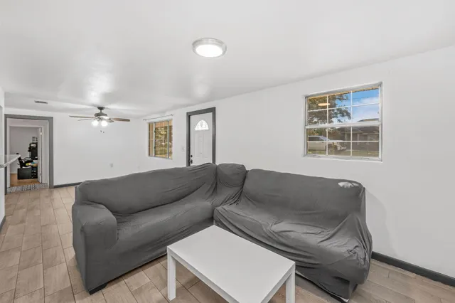 a living room with furniture and a window