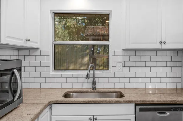 a view of a sink and a window