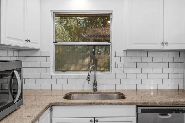 a view of a sink and a window