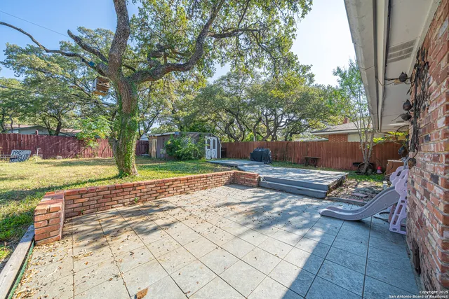 a view of backyard with green space