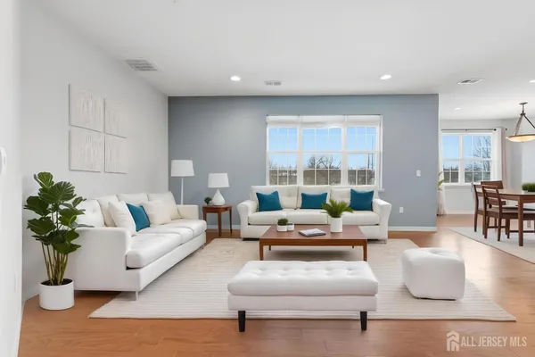 a living room with furniture and a large window