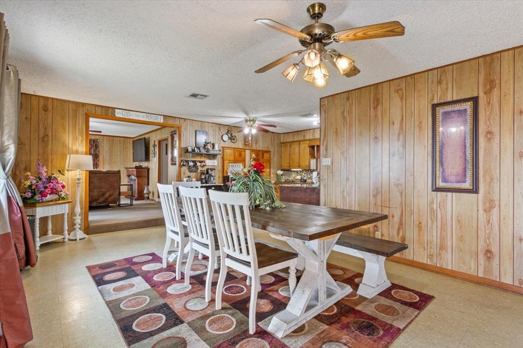 1832 West White Oak Road West, TX 76691 - Photo 13 of 30 a view of a dining room with furniture and wooden floor