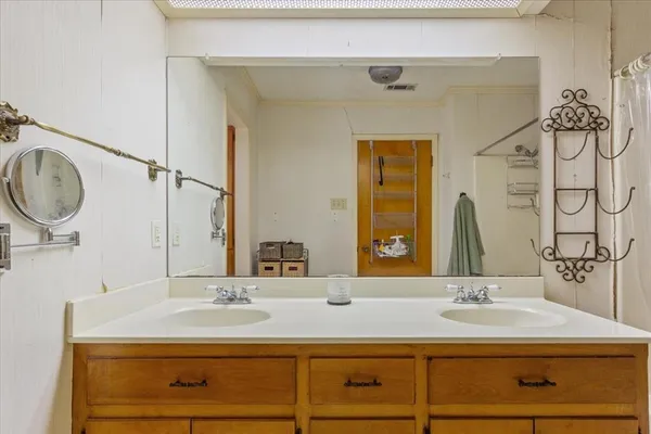 a bathroom with a sink and a mirror
