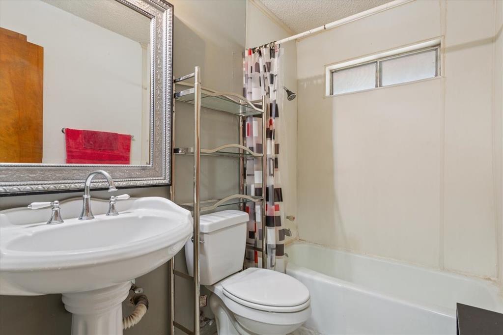 1832 West White Oak Road West, TX 76691 - Photo 24 of 30 a bathroom with a sink a toilet and shower