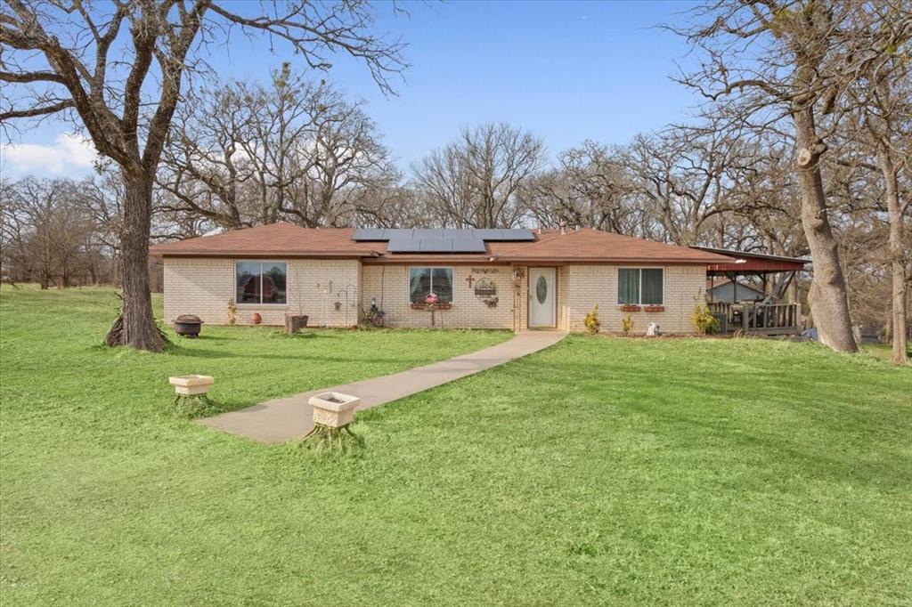 1832 West White Oak Road West, TX 76691 - Photo 7 of 30 a view of a house with a yard