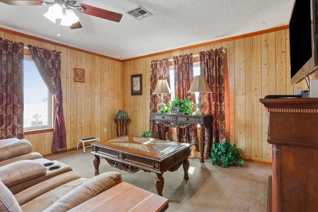 1832 West White Oak Road West, TX 76691 - Photo 9 of 30 a living room with furniture and a flat screen tv