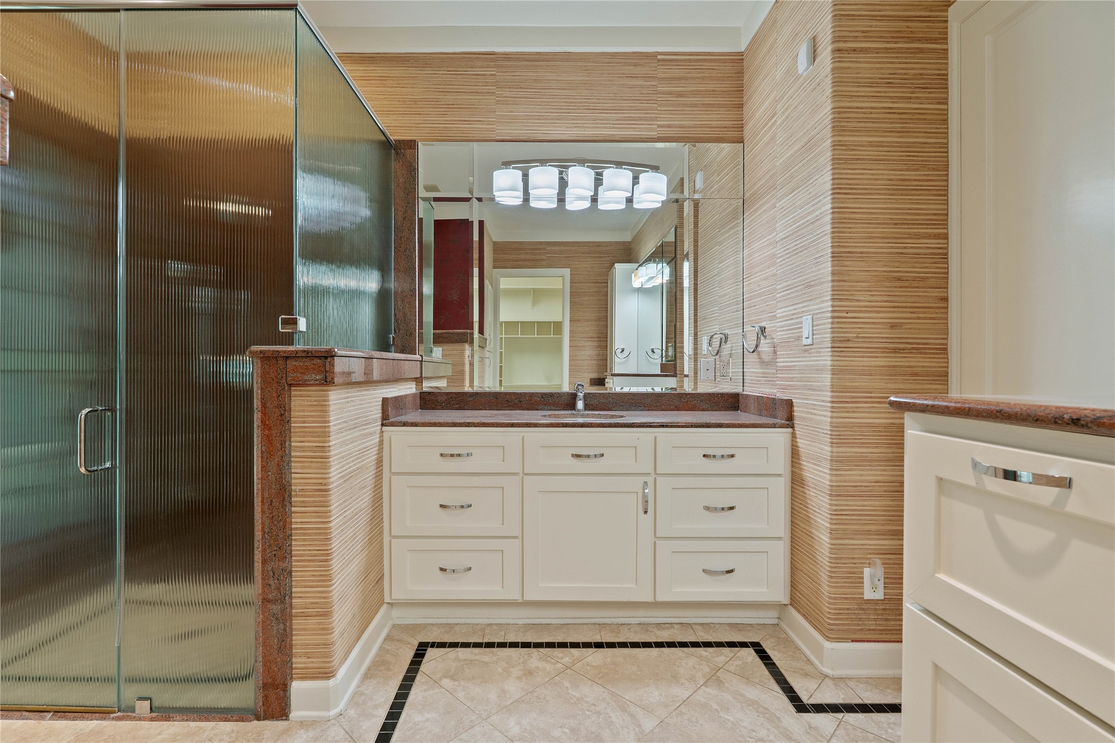 16621 Hereford Road Tomball, TX 77377 - Photo 23 of 46 Experience modern elegance in this full bathroom featuring a sleek glass-enclosed shower and stylish finishes.