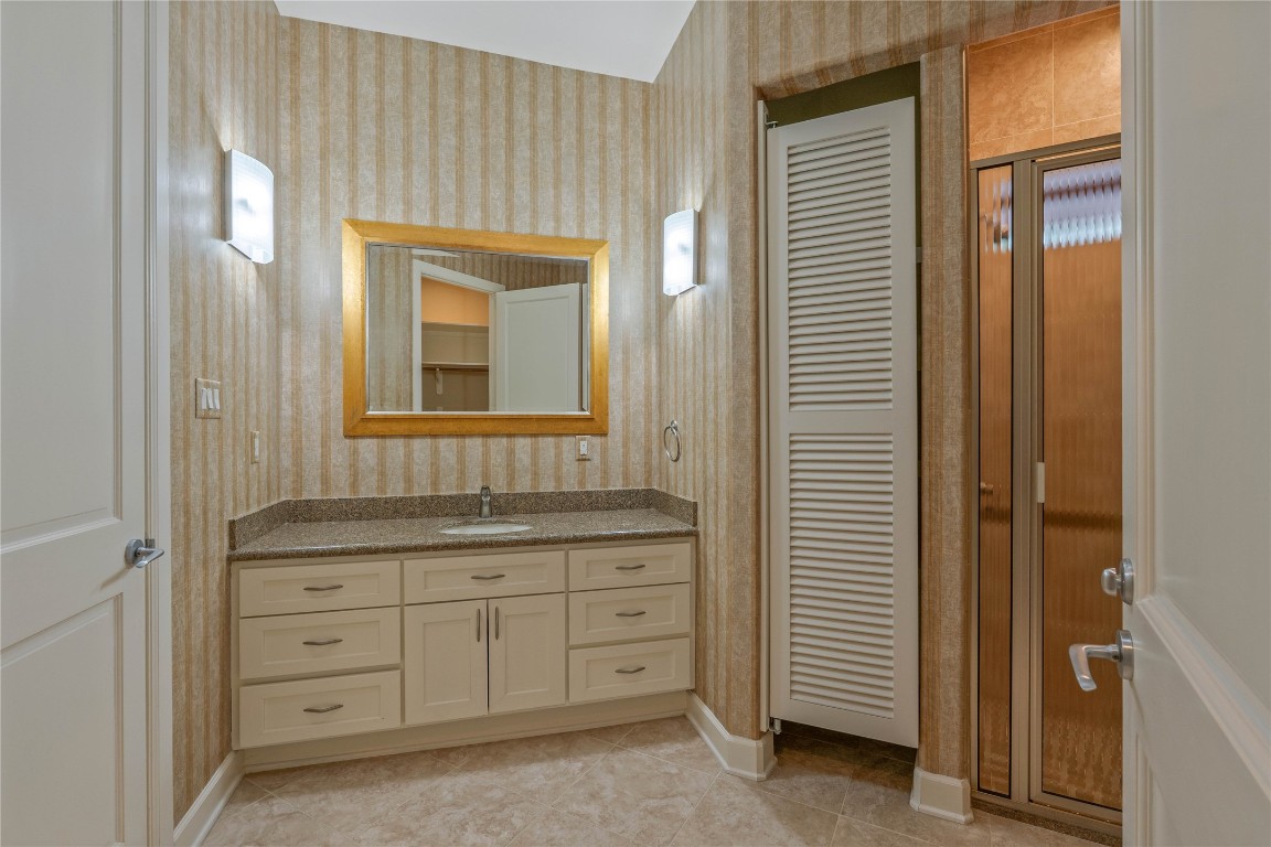 16621 Hereford Road Tomball, TX 77377 - Photo 39 of 46 a bathroom with a granite countertop sink vanity and a mirror