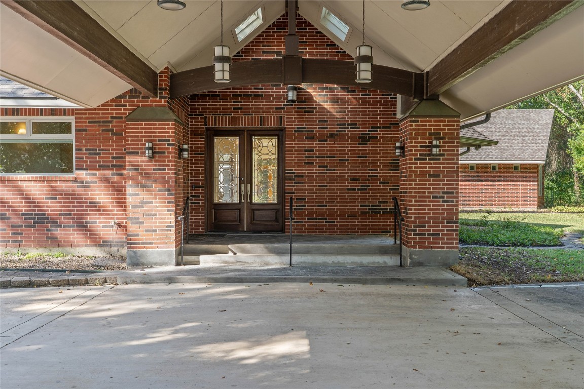 16621 Hereford Road Tomball, TX 77377 - Photo 4 of 46 a view of a brick house with a street