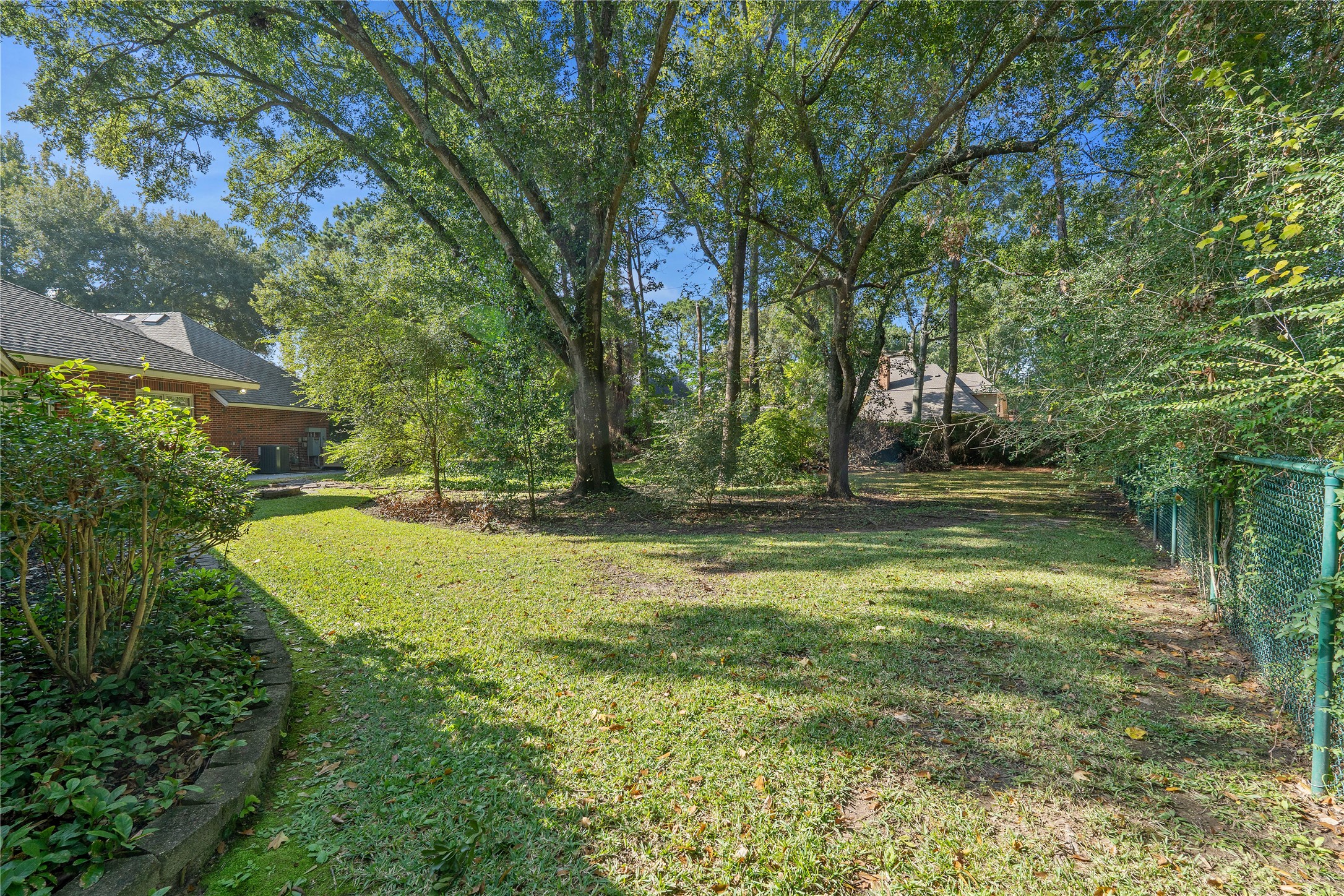 16621 Hereford Road Tomball, TX 77377 - Photo 41 of 46 Lush yard adorned by majestic, mature trees, perfect for relaxation and outdoor enjoyment.