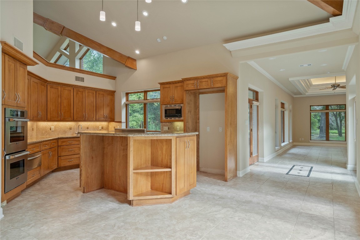 16621 Hereford Road Tomball, TX 77377 - Photo 6 of 46 a kitchen with counter top space cabinets and stainless steel appliances