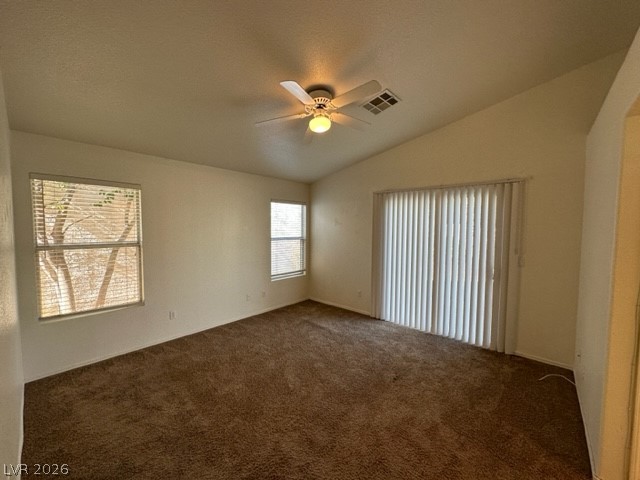 285 Spring Palms Street Henderson, NV 89012 - Photo 9 of 38 Carpeted empty room with a ceiling fan, visible vents, and lofted ceiling