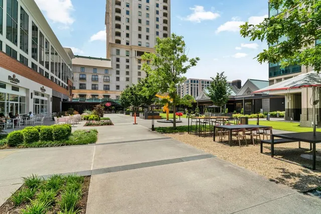 an outdoor space with seating area and hardwood floor