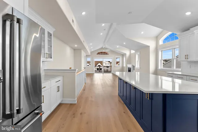 a kitchen with stainless steel appliances granite countertop lots of counter top space and refrigerator