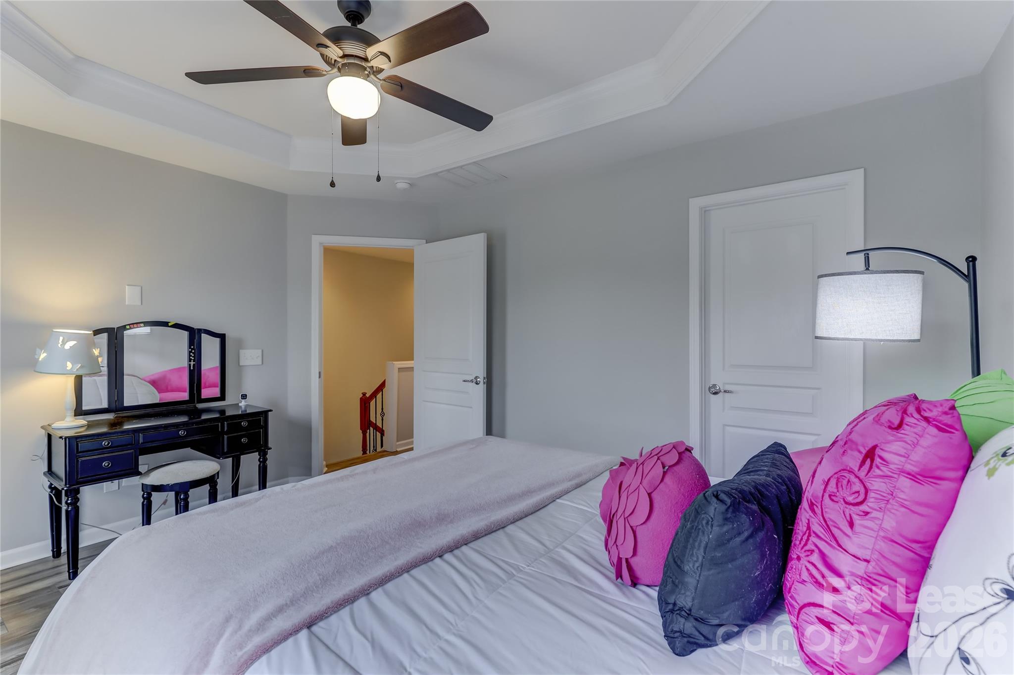 905 Lyndley Drive Fort Mill, SC 29708 - Photo 29 of 42 a bedroom with a bed and a chandelier